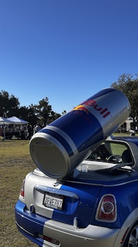 a red bull can on top of a car